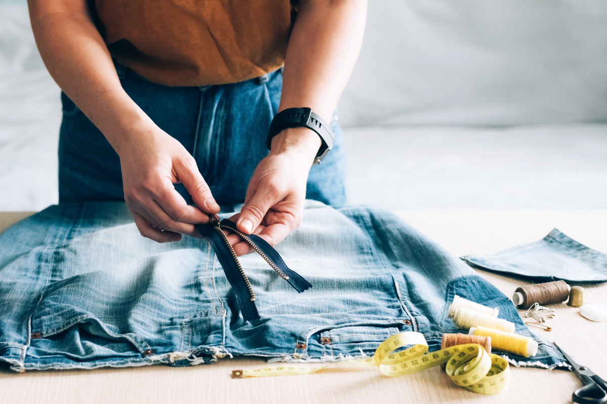 Woman Repairs Sews Reuses Fabric from Old Denim Clothes